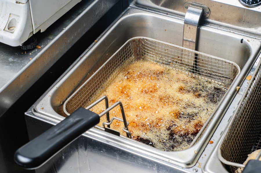 Deep fryer filled with cooking oil
